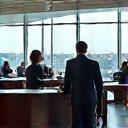 A modern airport lounge with business professionals.